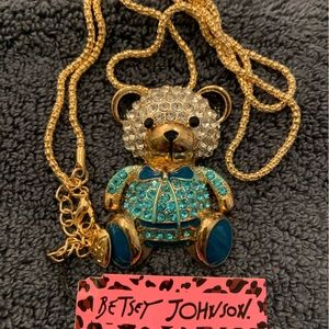 BJ boy teddy bear is set in blues, silver and black rhinestones. Drop is 12”.